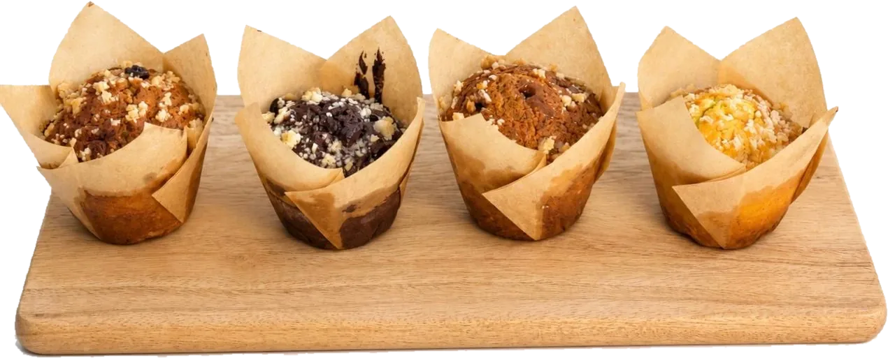 The Tea Cakes: four muffins in tulip cases on a wooden board